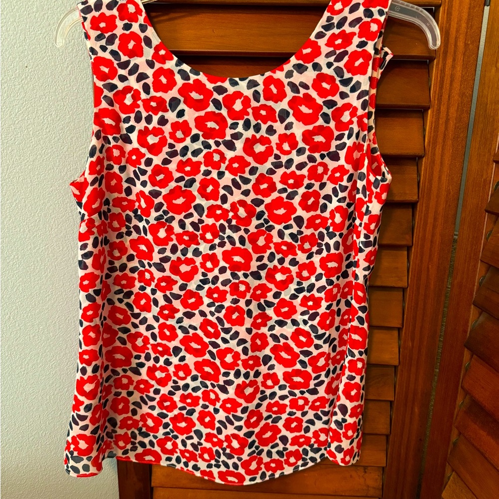 Fully lined Cabi blouse. Ruffled neckline can be worn in front, or back!!